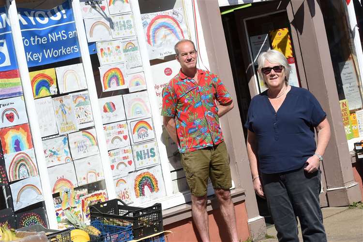 Boxford post office has displayed tributes to the NHS in its store window. The pieces has been created by youngsters in the village..Pictured: Diane Whitley and Post Master Richard Haining